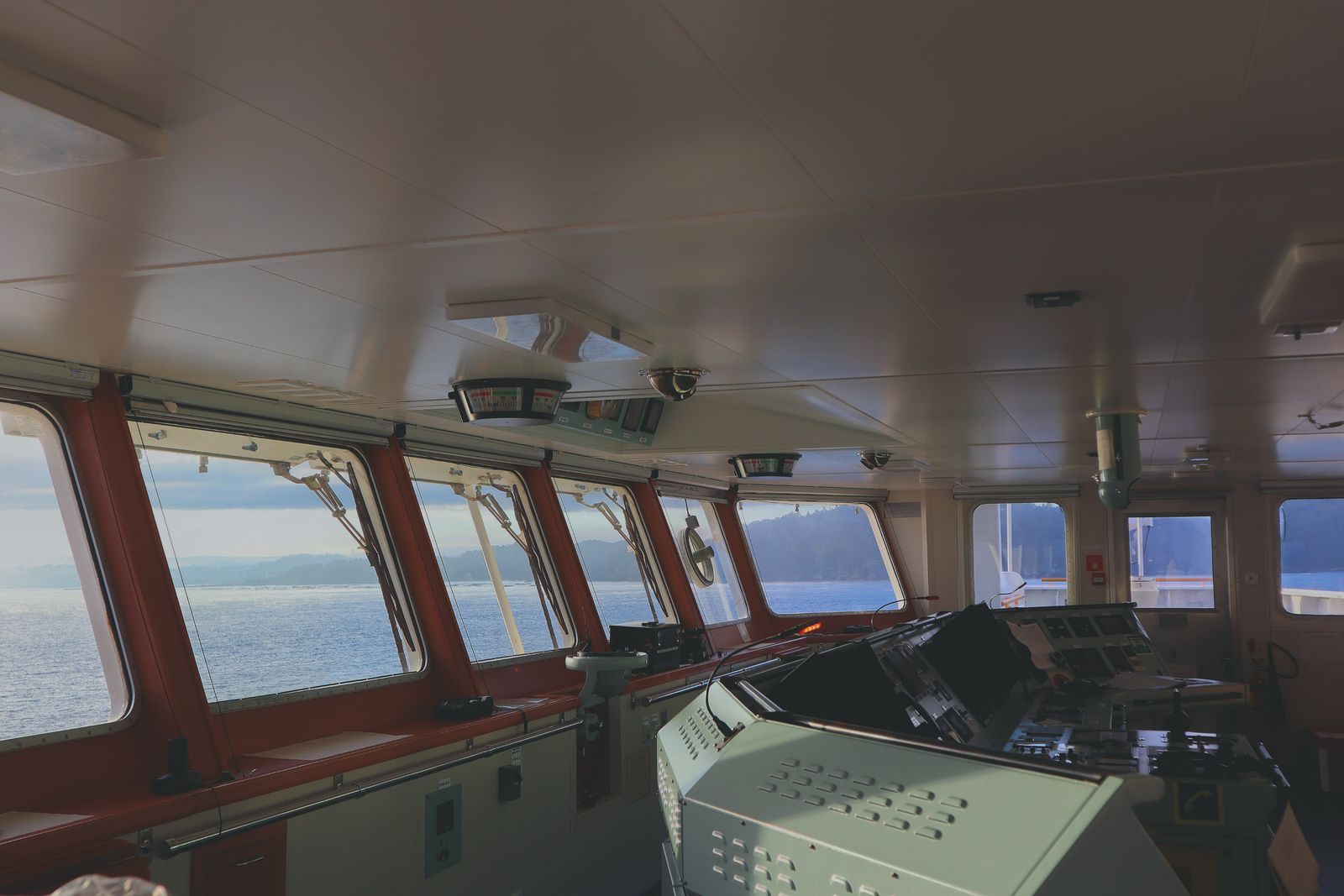 Interior of a ship bridge with a panoramic sea view
